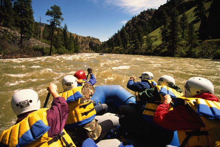 Rafting the Salmon River, Idaho Six white water rafters navigating the brown rapids of the Salmon River along the Salmon River Trail.