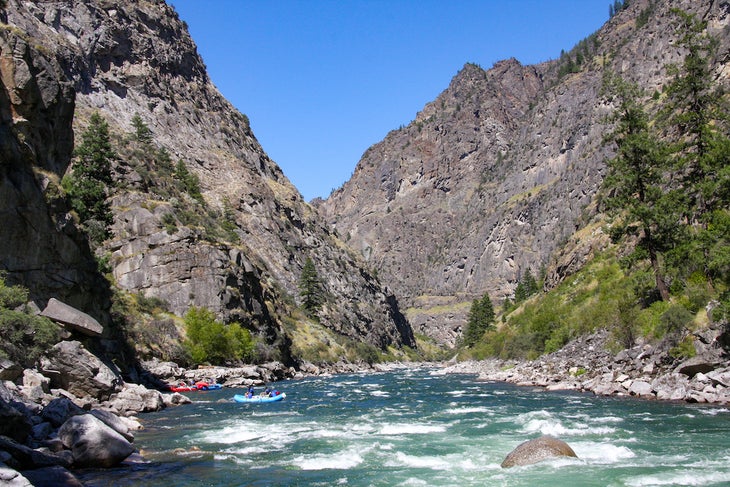 Salmon River Trail, River of No Return Wilderness, Idaho Colorful boats float along the rapids of the Salmon River as seen from the Salmon River Trail.