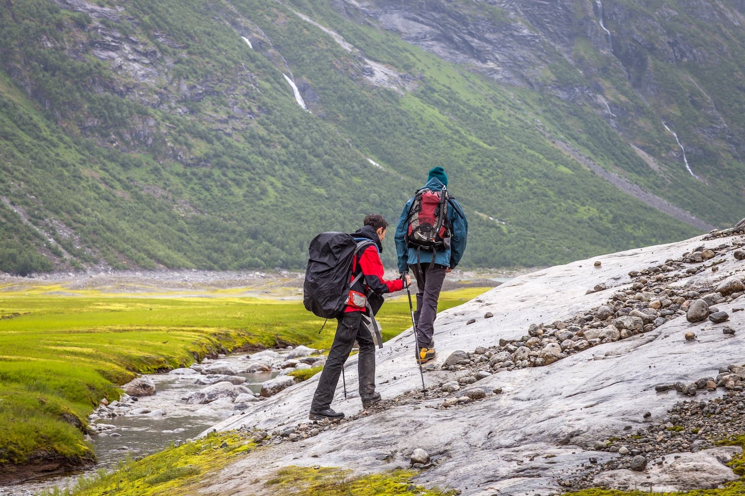 Men Walking On Wet Field