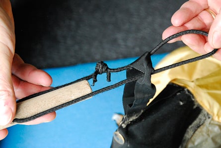 3) Slip the cord end through the stake-out loops or guylines of your tent. None