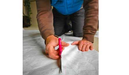 Cut around the tent perimeter outline with scissors. Important: Cut one to two inches inside the traced line.