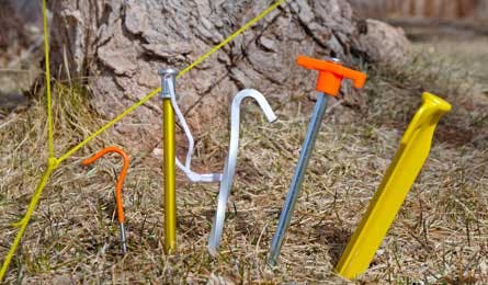 TentStakes4 32990 Grass and soft soil are the easiest staking grounds. Most any stakes will work, even light pegs. For big tarps and high winds, choose long, heavy,…