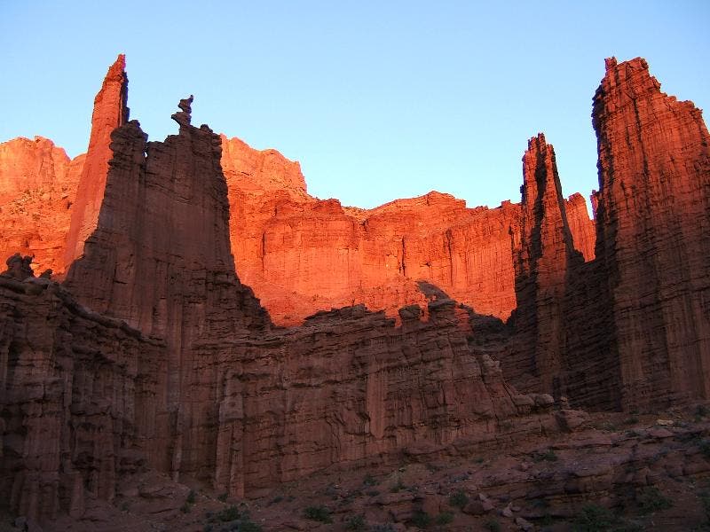 Ancient Art glows in burnt red as the sun sets.