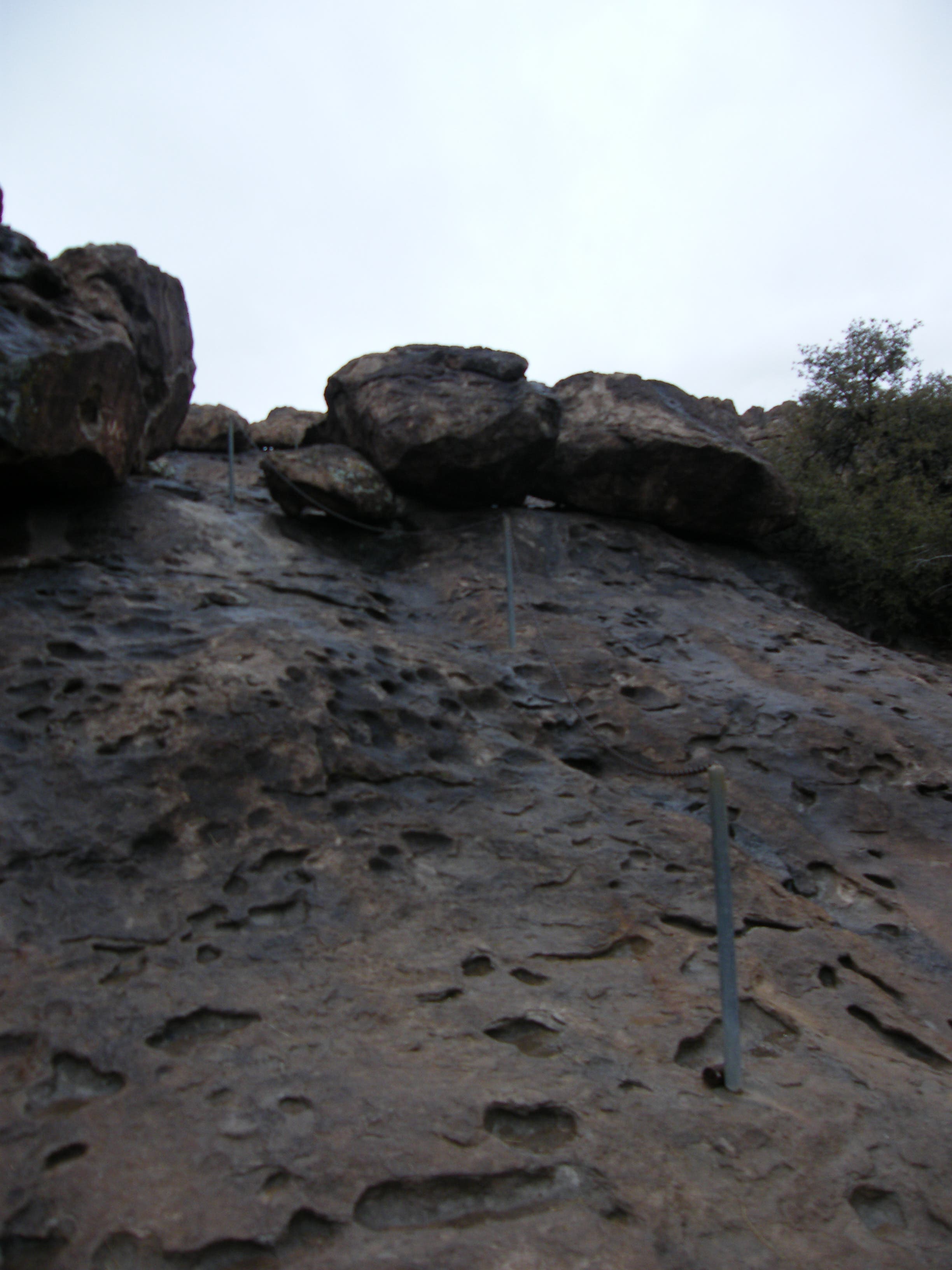 Chains help climbing up the rock. None