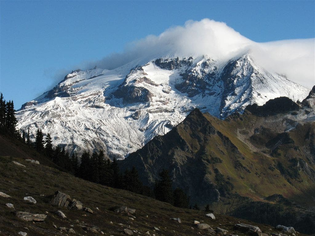 Cloud-covered peak None