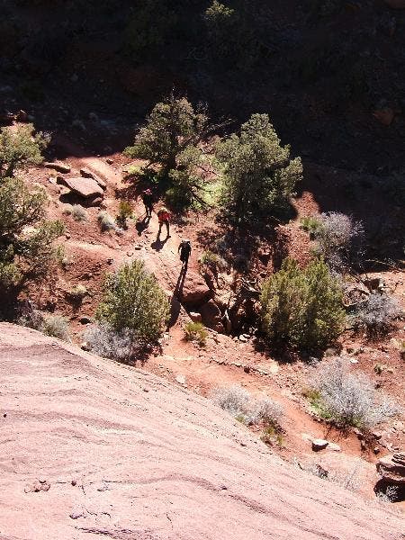 Dome view A view from one of many sandstone domes down into a wash where the trail is winding through on its way deeper into the park. The trail moves up to…
