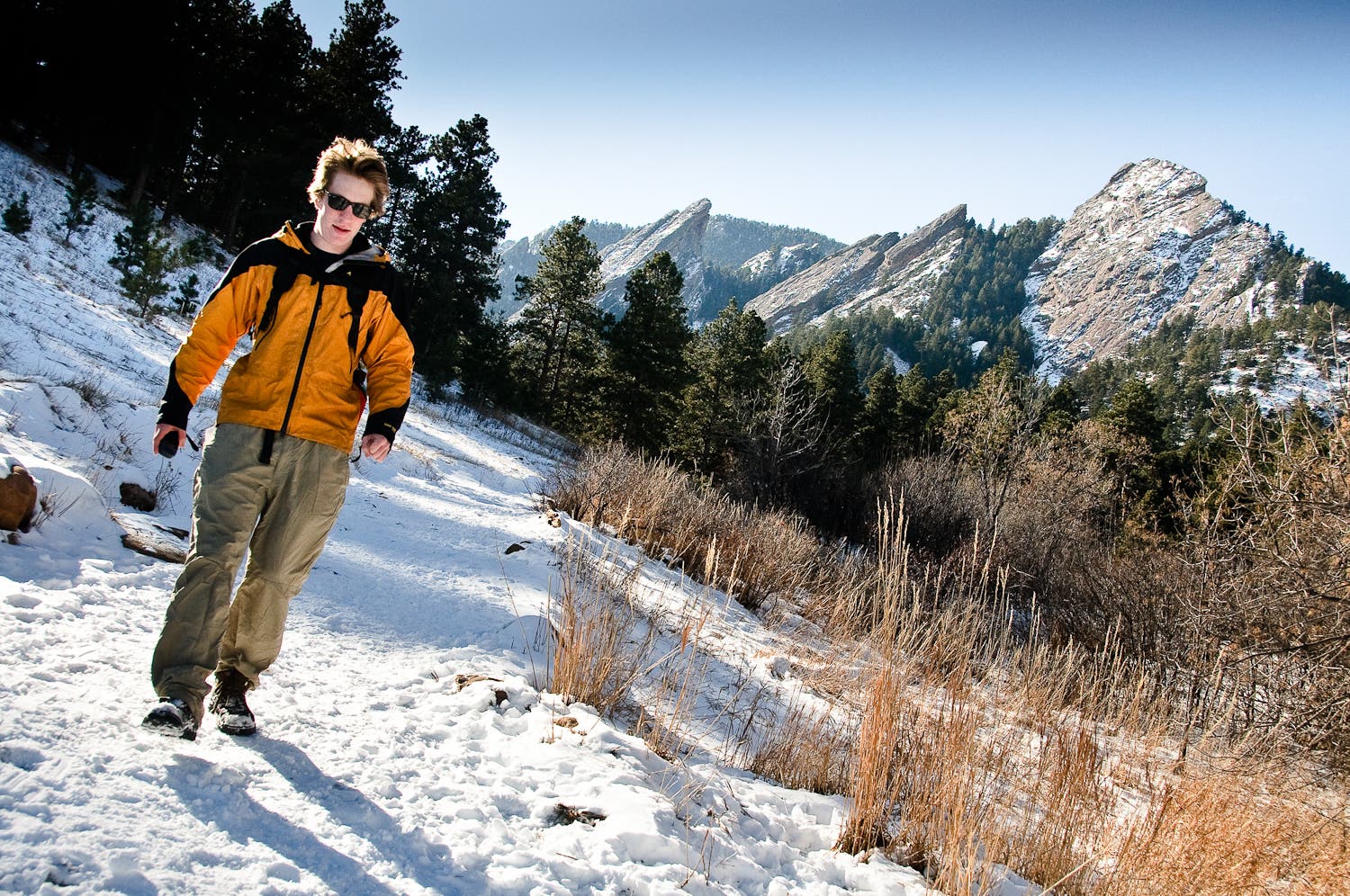 View of the Flatirons from the Chautauqua Trail. View of the Flatirons from a snow-covered Chautauqua Trail.