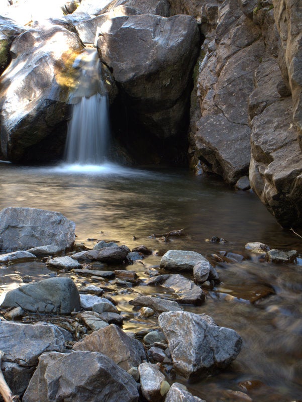 A waterfall cascades into a small pool off the sides of the Colorado Trail just outside of Stony Pass. 