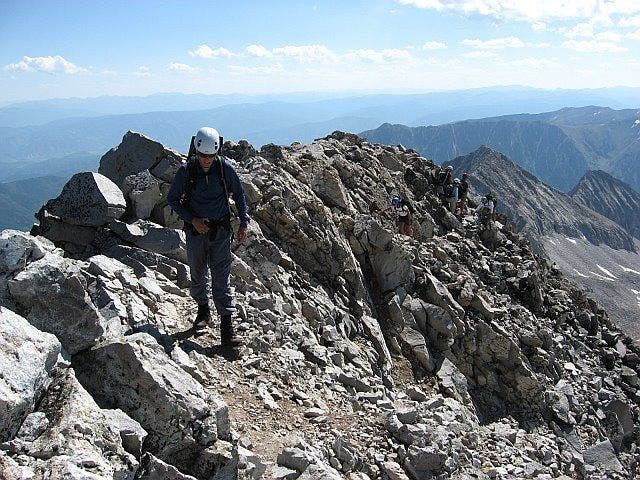 Hikers on the final summit ridge None