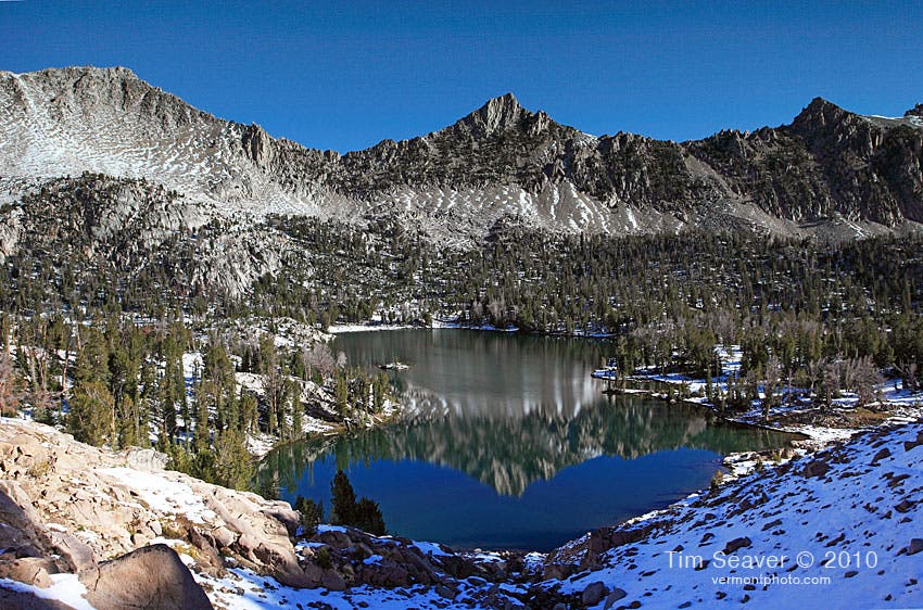 Hummock Lake From Scoop Lake Outlet Hummock Lake, as seen from Scoop Lake Outlet, with mountains towering beneath a blue-bird sky on the hike along the White Cloud Loop Trail.