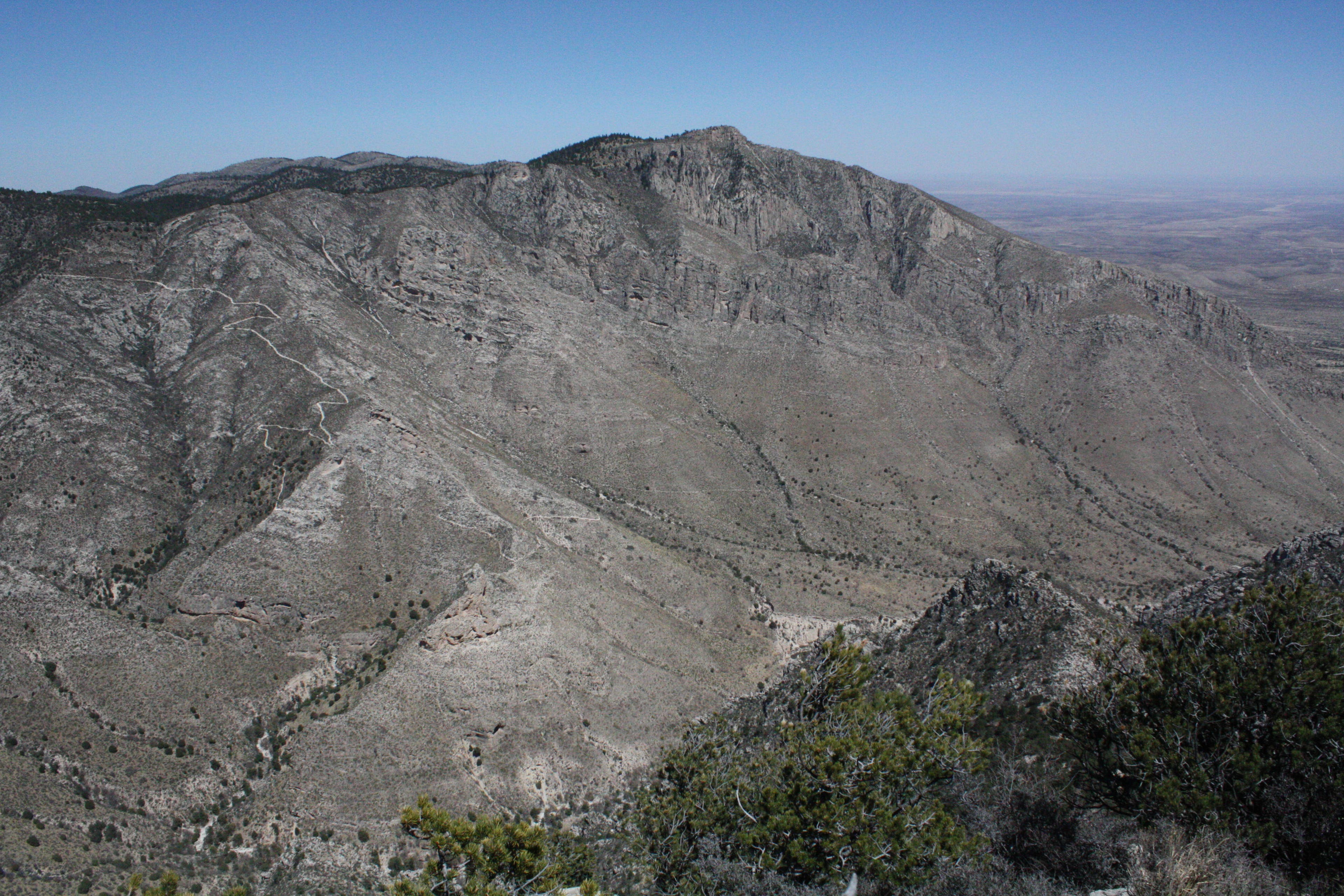 Hunter Peak views from the Guadalupe Peak hike. Hunter Peak towers above the arid desert land.
