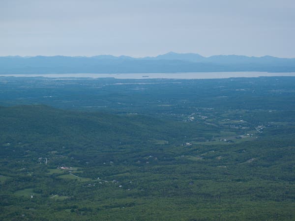 Distant views of Lake Champlain from the summit of Mount Mansfield.