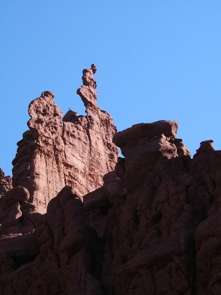 First good view of Ancient Art. The route climbs up the backside of the tower to the small ridge in the sun on the right skyline. Then it wraps up…