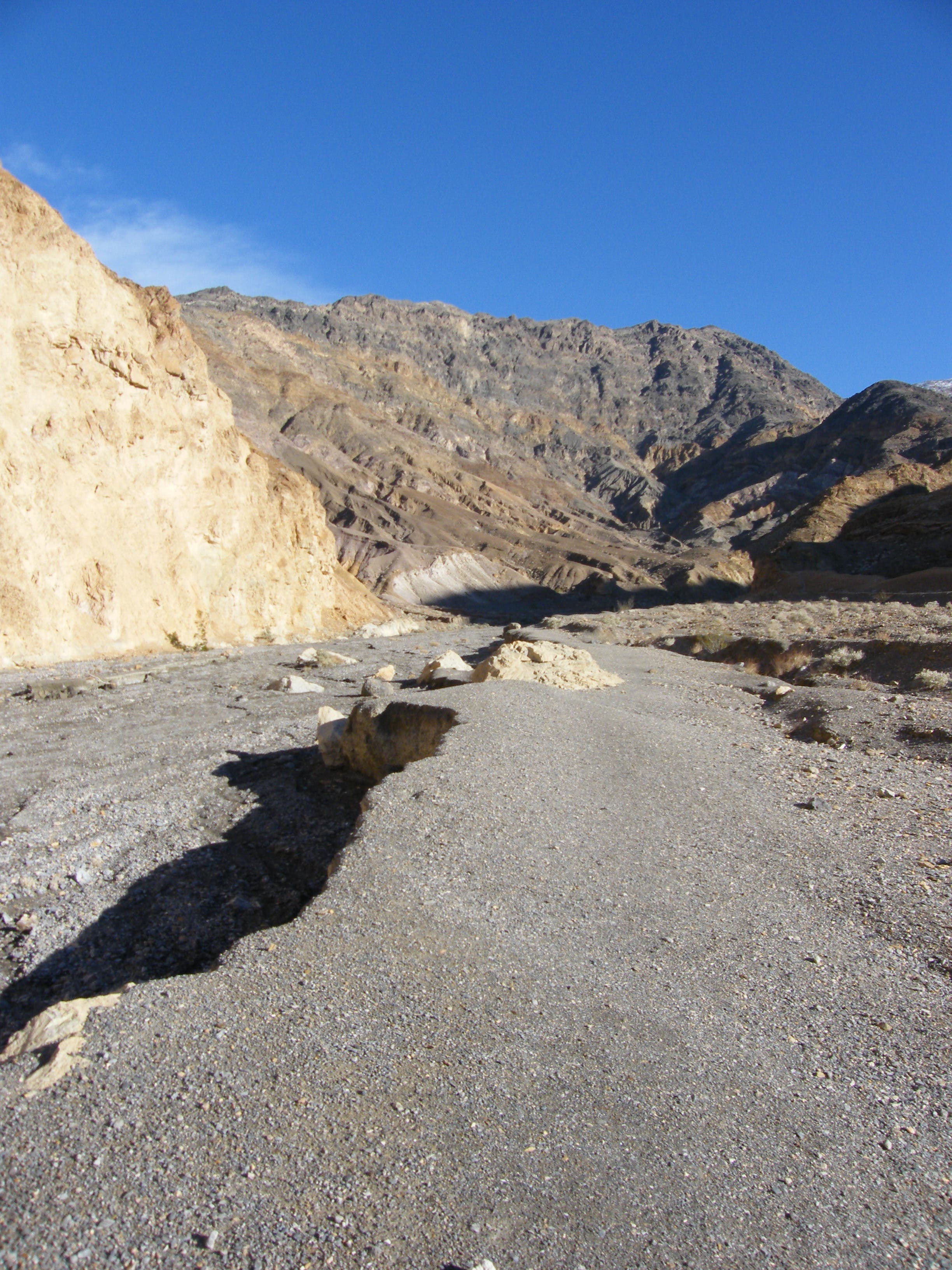 More packed surface on side of the wash. None