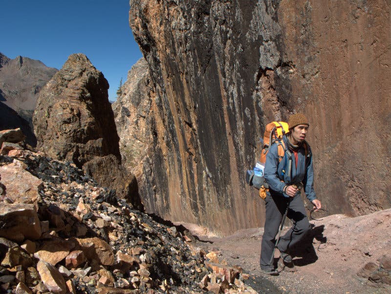 Notch in the rock along the Colorado Trail from Stony Pass to Celebration Lake. A notch in the rock leads hikers from Stony Pass to Celebration Lake.