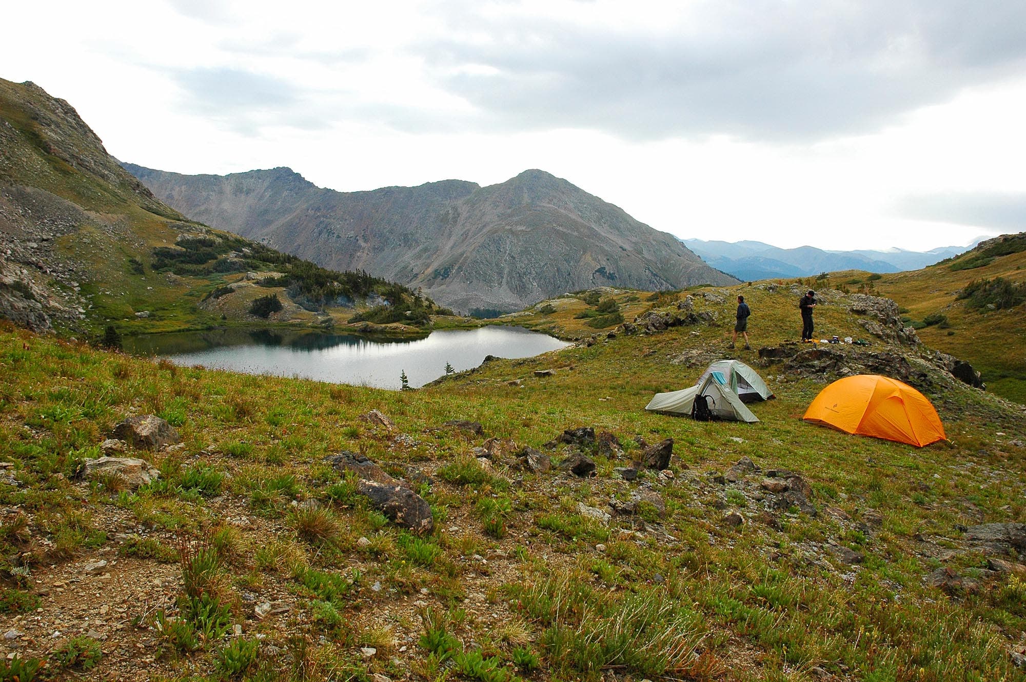 Hikers hang out outside their two tents along the shores of Parika Lake on the Baker Gulch to Bowen Gulch Trail. 