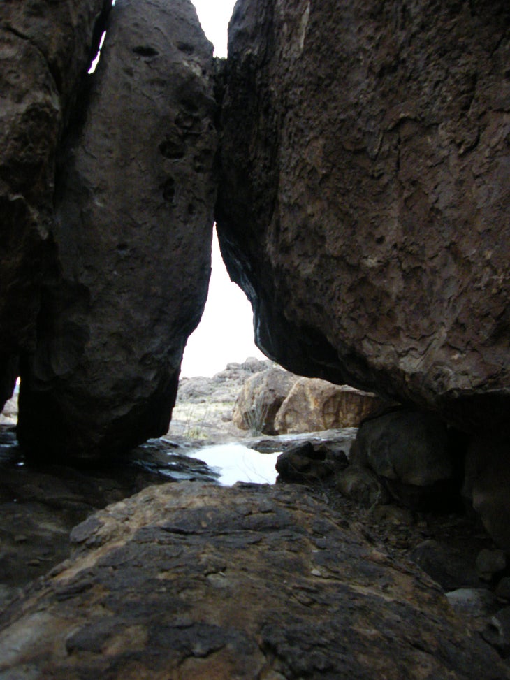 Passage through boulders. None