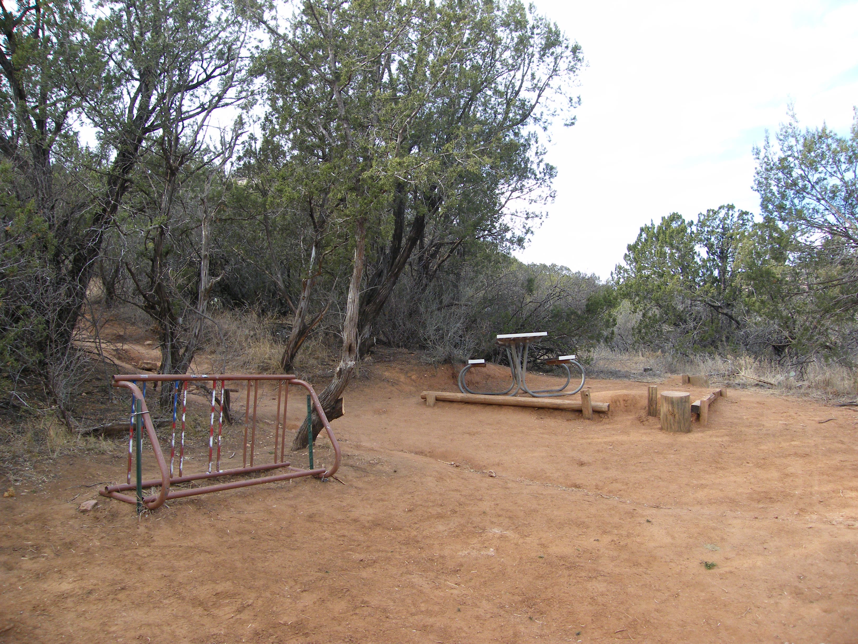 Picnic table, bike rack. None