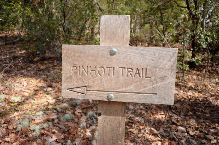 Close up of Pinhoti Trail directional sign in state park in Alabama
