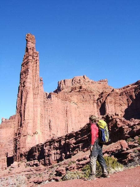 John surveys the walls for other possible routes.
