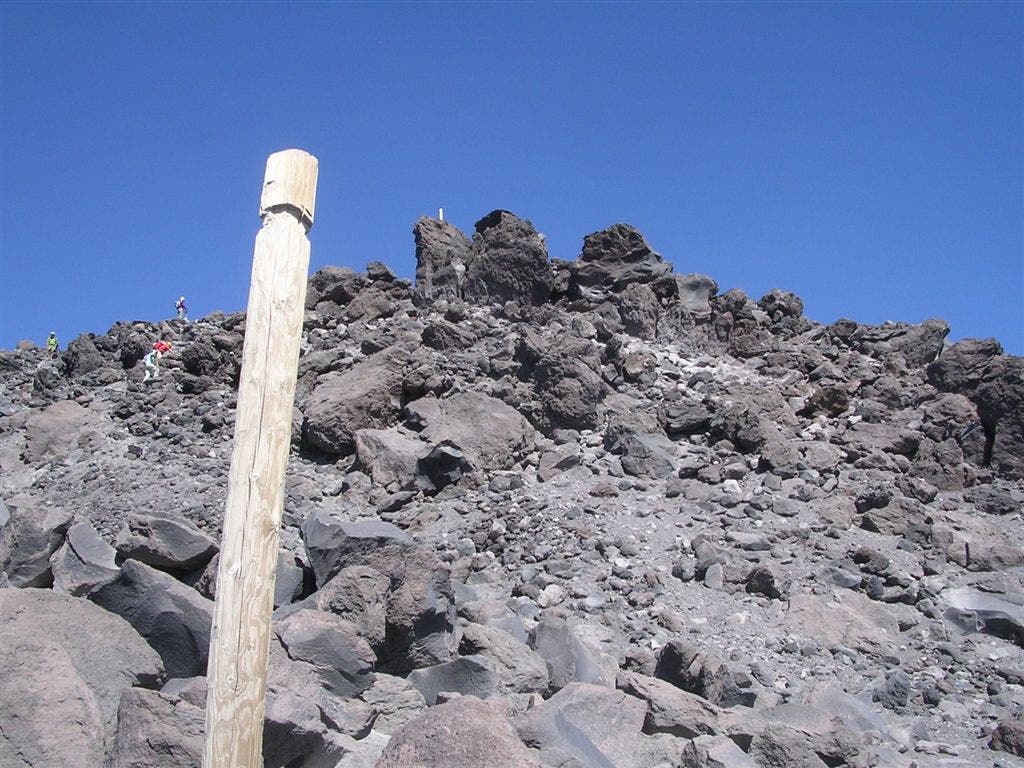 Rock/Boulder gardens and wooden post marking the path None