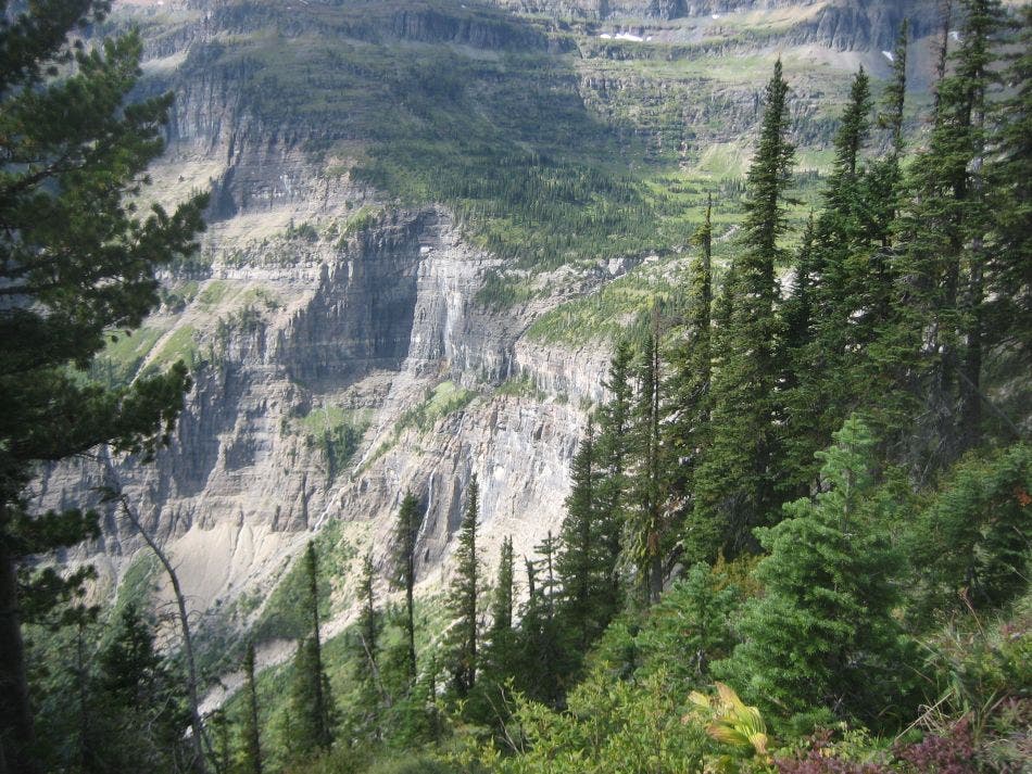 Hole-in-the-Wall's headwall and 800-foot waterfall. Sheer cliffs of Hole-in-the-Wall and a long-distance view of the 800-foot waterfall.