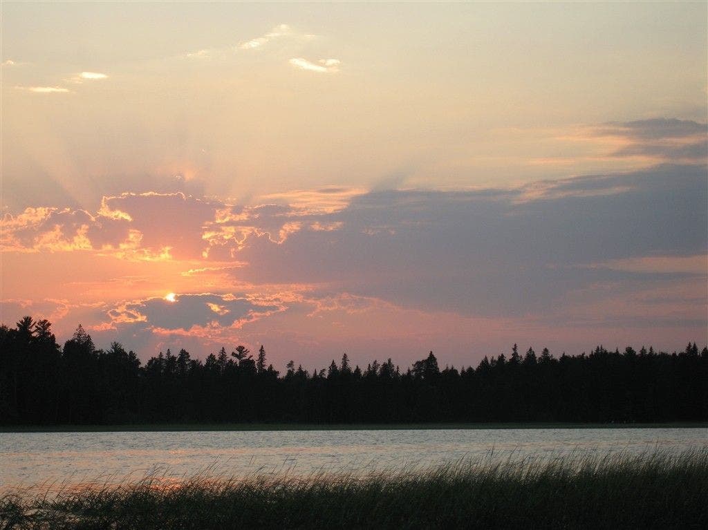 Sunset through clouds None