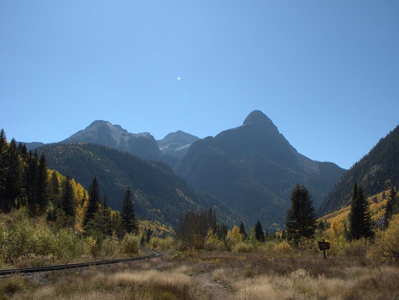 The Grenadier Range as seen from the Colorado Trail between Stony Pass and Celebration Lake. The Grenadier Mountains set against a bright blue sky as seen from the Colorado Trail between Stony Pass and Celebration Lake.