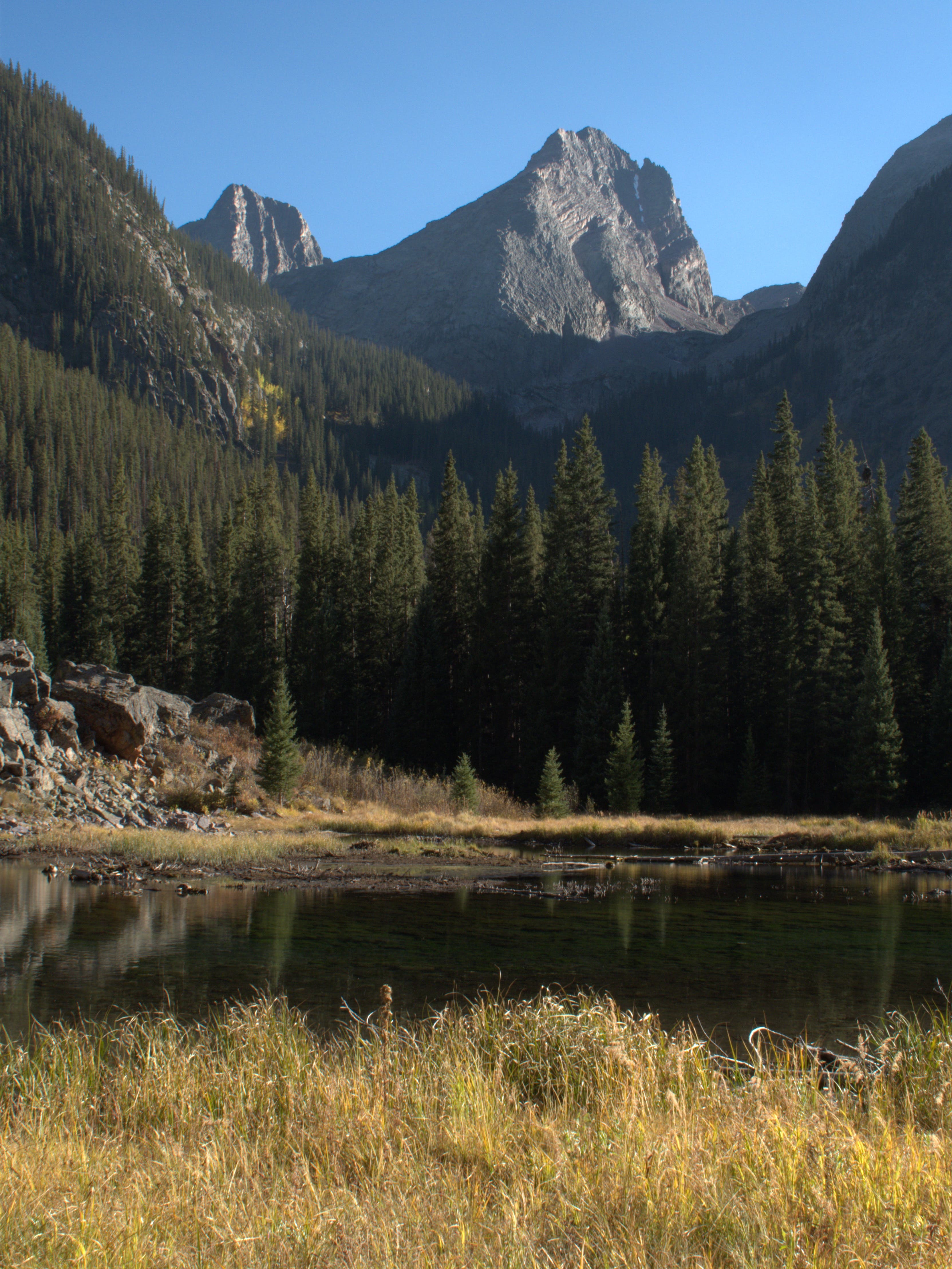 A small beaver pond along the CT from Stony Pass to Celebration Lake with Vestal and Arrow peaks towering in the background. 
