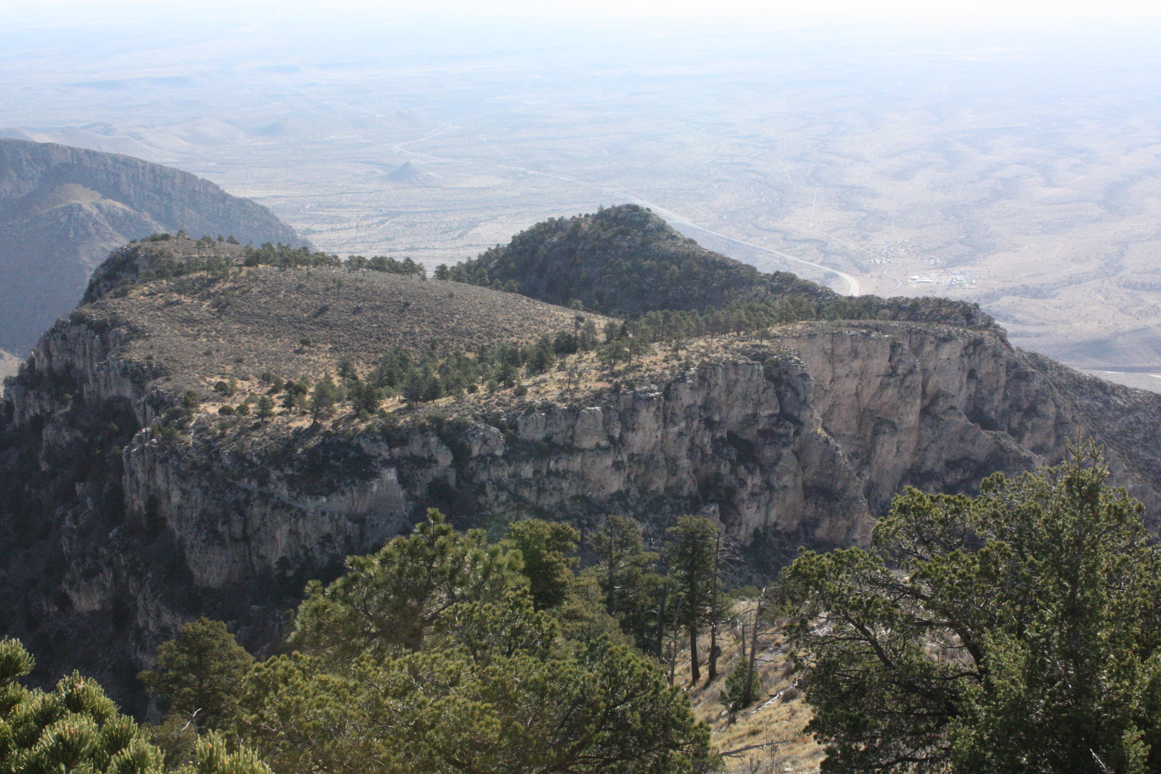 the Guadalupe Mountains Backcountry Campground from the Guadalupe Peak Trail. A birds-eye view of the Guadalupe Mountains Backcountry Campground from the summit of Guadalupe Peak.