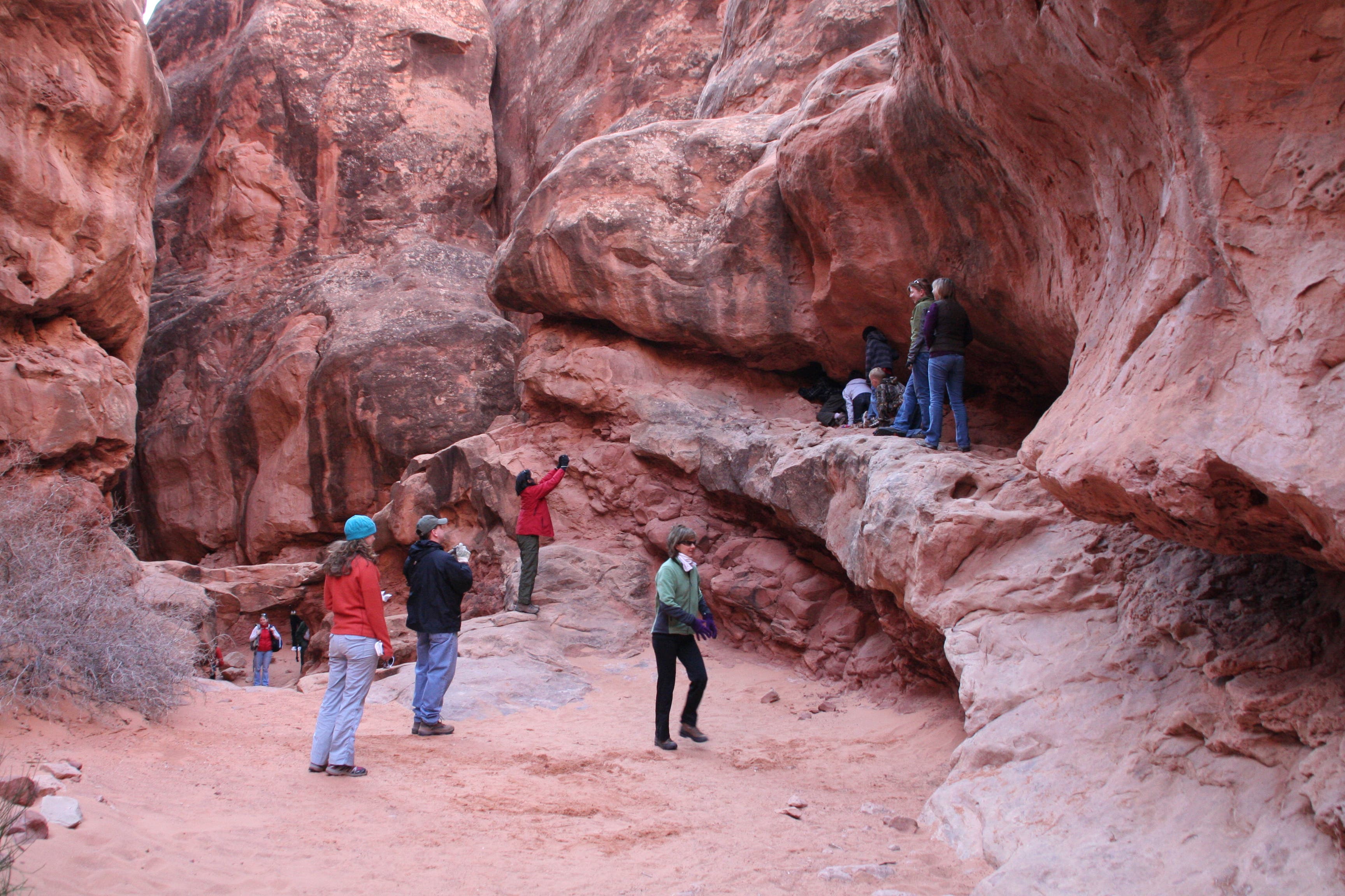 Waiting to climb through the rock hole None