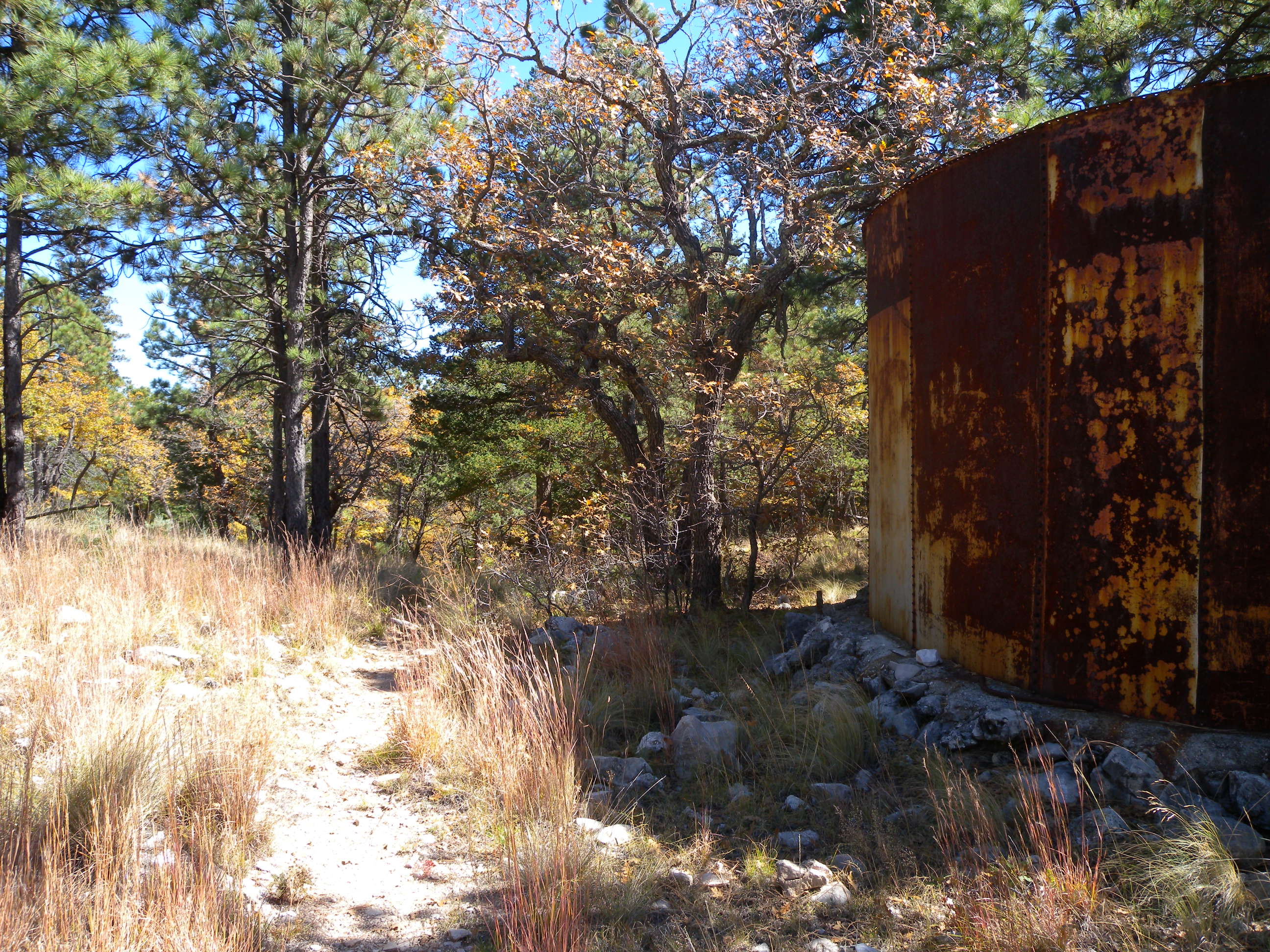 A rusty water tower marks the saddle just before the trail drops into the Bowl. A rusty water tower marks the saddle just before the trail drops into the Bowl.