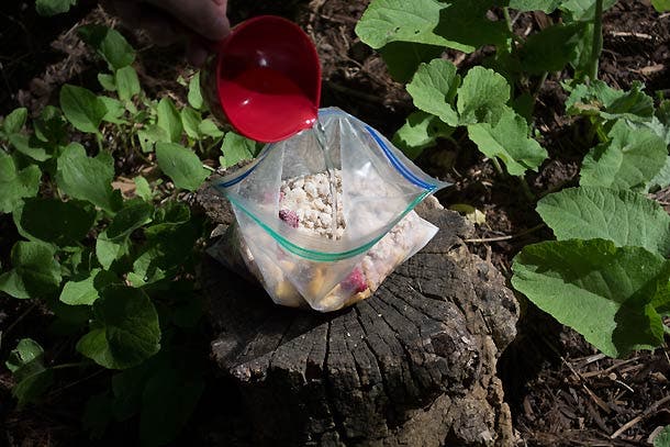 Pour ½ cup water into bag