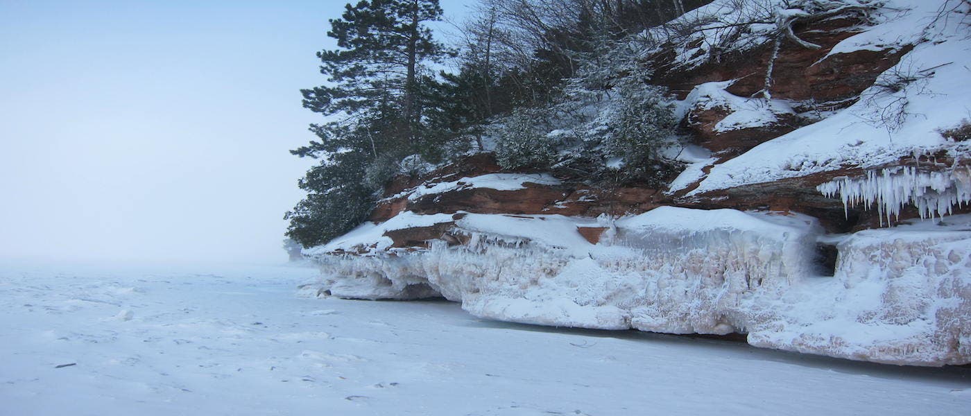 Apostle Island Ice Caves The caves lie approximately 18 miles west of Bayfield, Wisconsin and are a popular summertime kayaking destination.