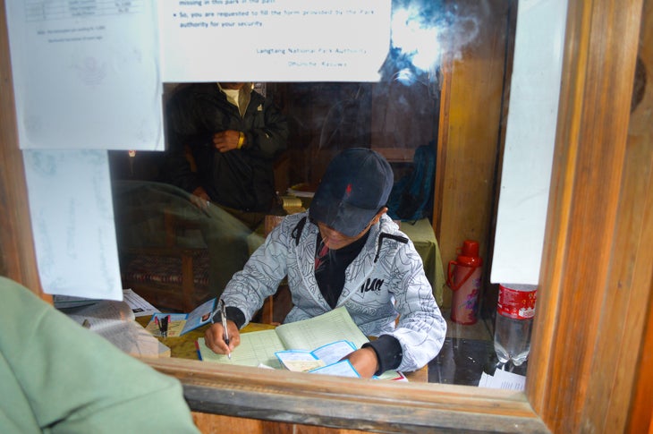 Fellow Trekker A trekker in Nepal at the TIMS office registering his passport.