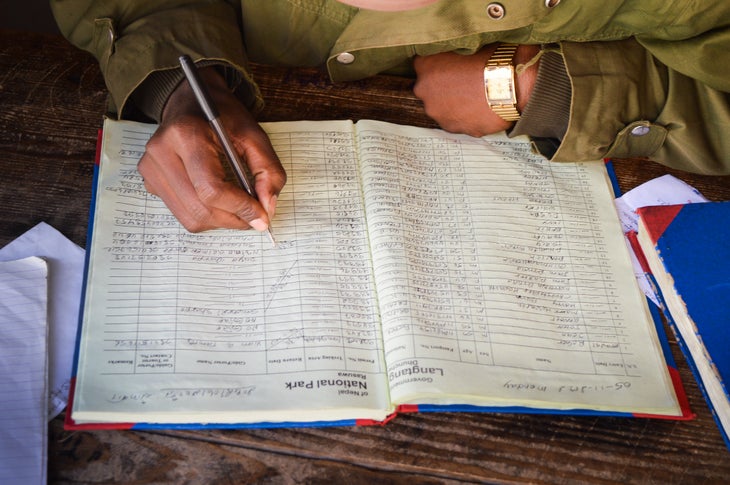Signing In Army-operated trekkers' registers along the way to Kyanjin Gompa