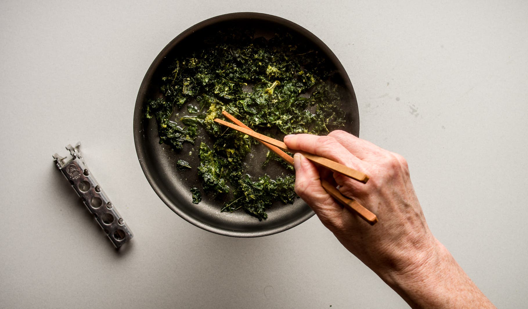 Immediately add the kale chips to the remaining water, heating and stirring for about 30 seconds, until they are fully reconstituted and warm.
