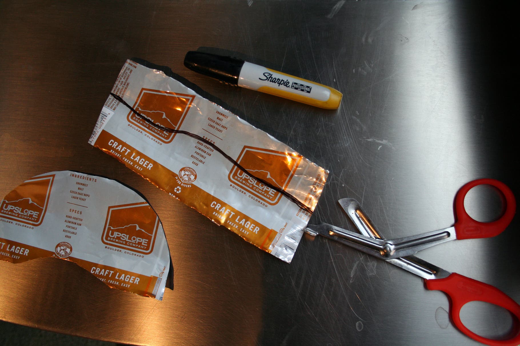 Beer Can Visor: Step 5 Now, cut with scissors.