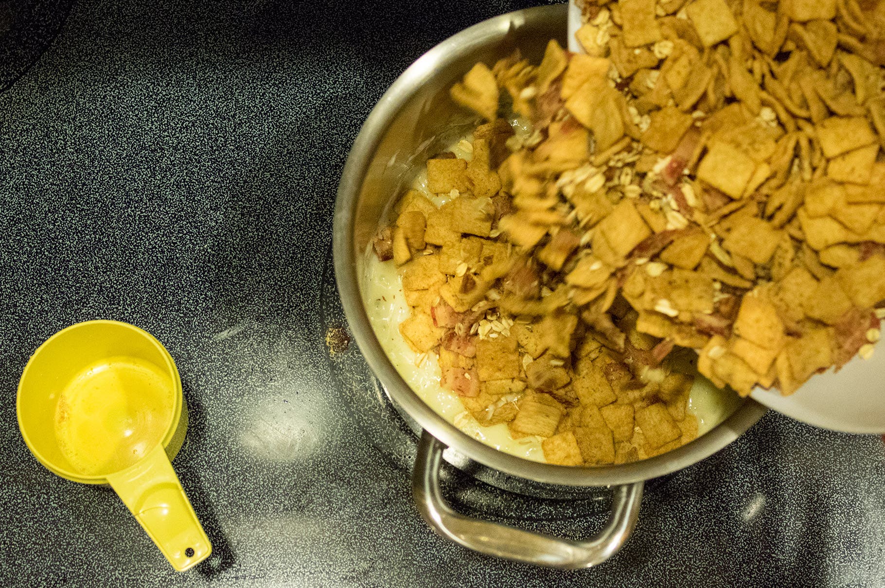 Add cereal and bacon mixture. Stir well, using a rubber scraper, until well incorporated.