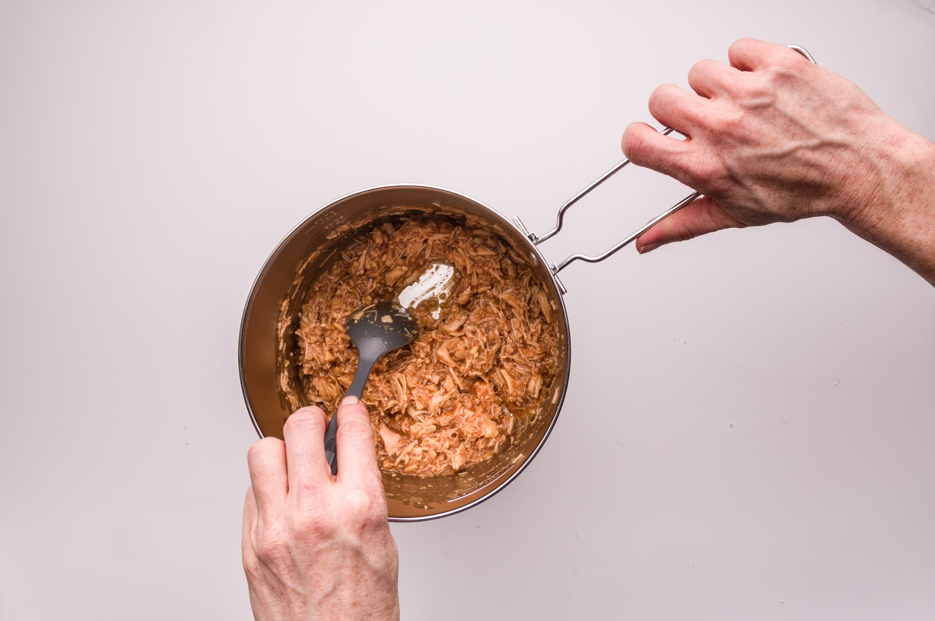 Heat mixture over a low-medium flame, stirring continuously to break up chicken and incorporate sauce (if your stove doesn’t simmer, lift the pan a…