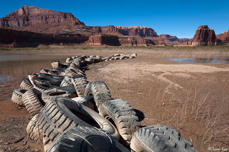 Breakwater Barriers Around Hite Marina Old chained-up tires once used as breakwater barriers around Hite Marina now rest on mud flats at a location that was 98 feet below the surface of…