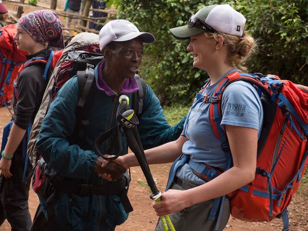 Clement & Hadley Clement, our assistant chief porter, congratulates Hadley Dorn, the author’s daughter, upon her arrival at the Mweka Gate.