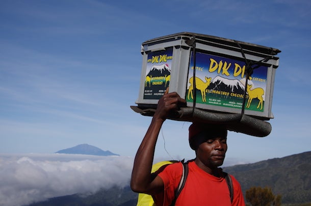 Porter on Kilimanjaro Kilimanjaro National Park requires visitors to employ local porters to carry their gear, which makes the climb easier – but also fills the day with…