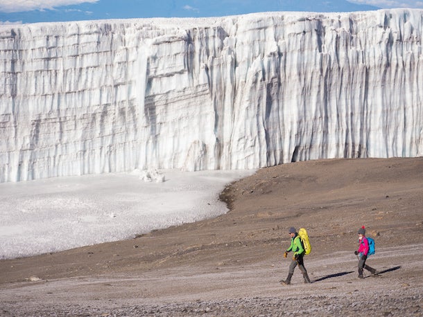 Rebmann Glacier Lead guide Peter Whittaker and his daughter Gabriella are dwarfed by the Rebmann Glacier, once part of an ice cap that covered Kilimanjaro’s slopes…