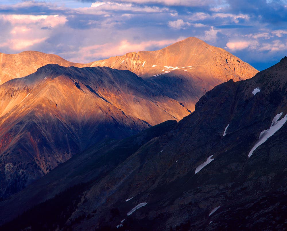 Sunset light on Sunshine Peak, one of Colorado's 54 \