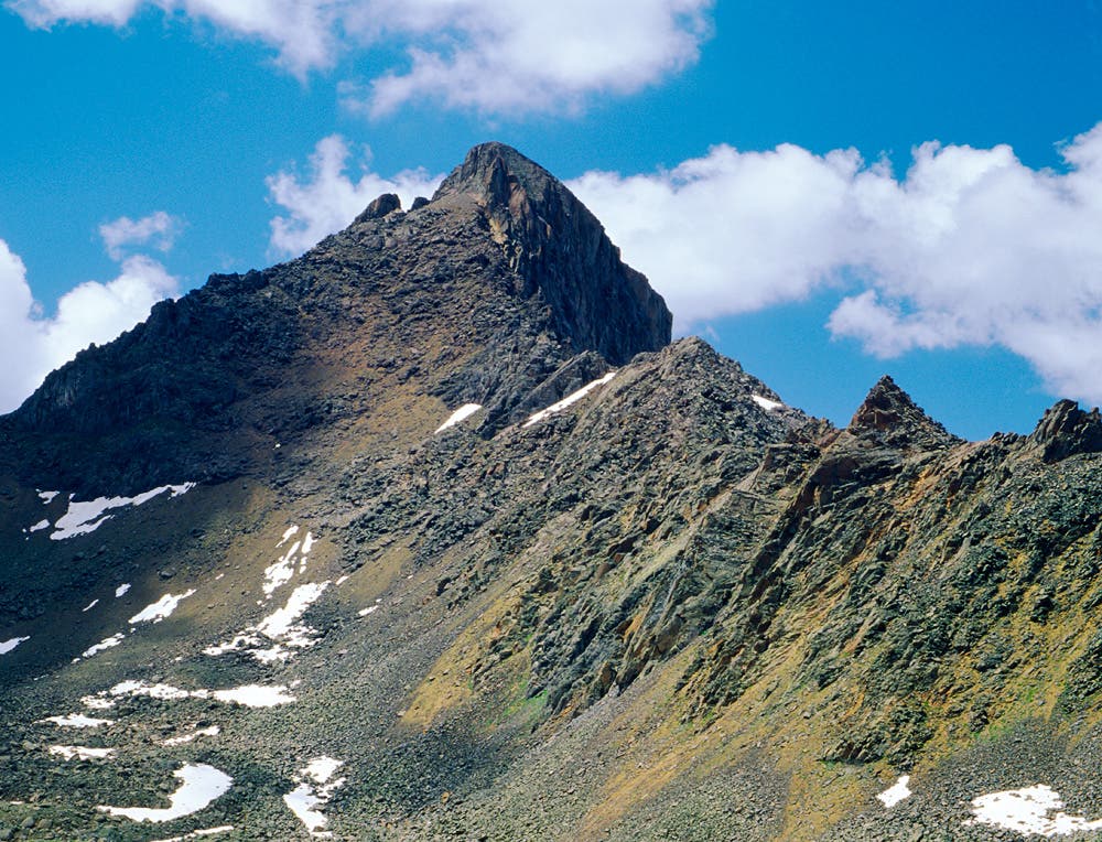 Wetterhorn Peak Summer Summer clouds drift over Wetterhorn Peak, one of Colorado's 54 \
