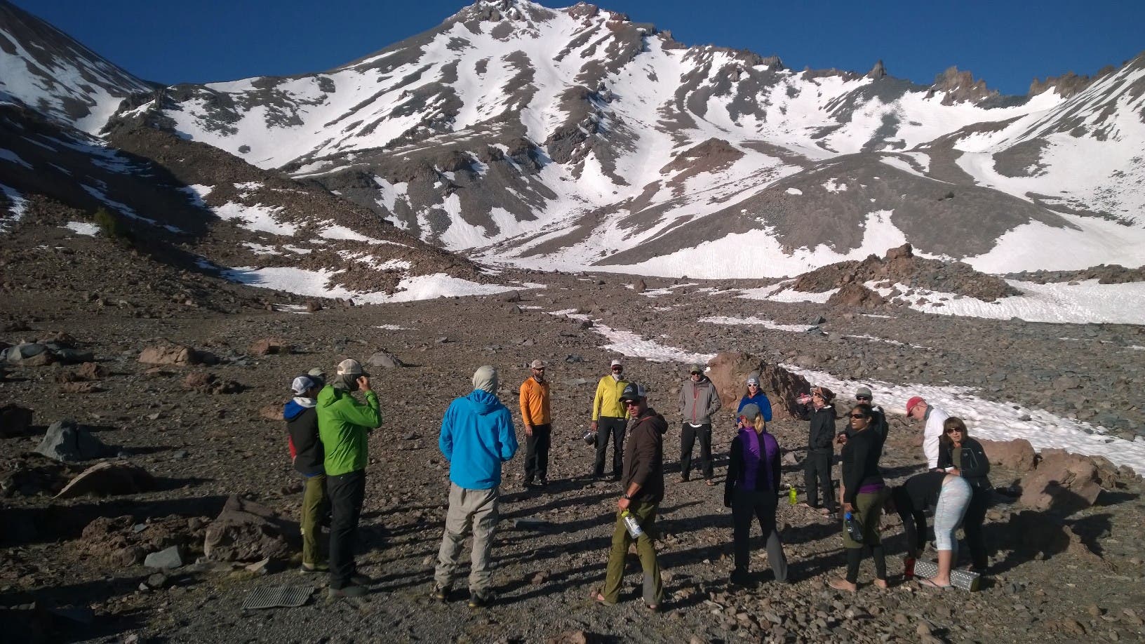 Climbing Mount Shasta Heading up Shasta on Sunday morning, a quick break at dawn. About 4,000 feet of climbing to go.