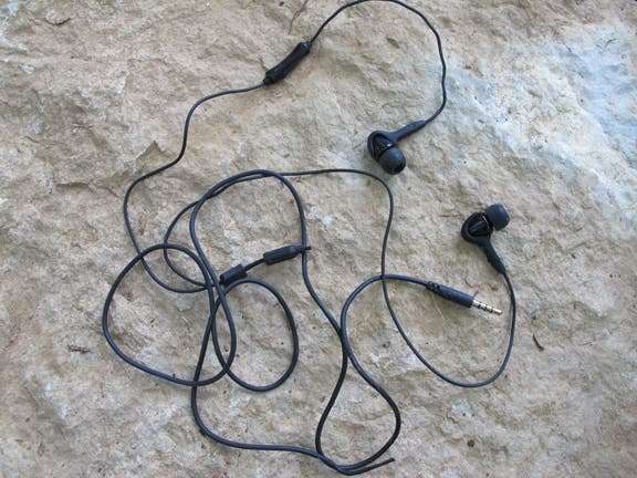 Headphones Hopefully you packed the headphones because the supple wires can be useful cordage.