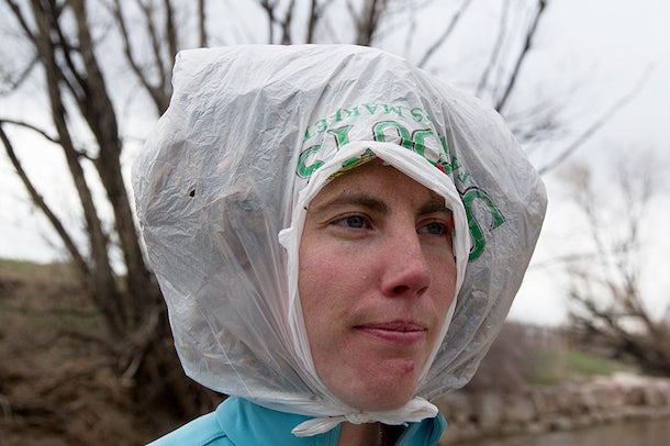 Rain Hood It may look weird, but it’s warm and waterproof. Fill a plastic bag with leaf litter or other dry, airy materials and tie it on your head.