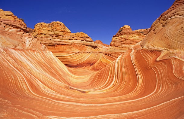 The Wave, Paria Canyon-Vermillion Cliffs Wilderness, AZ The Wave offers a breathtaking cross-section of geologic history. Its rippling sandstone formations have been eroded by wind and water, and reveal…